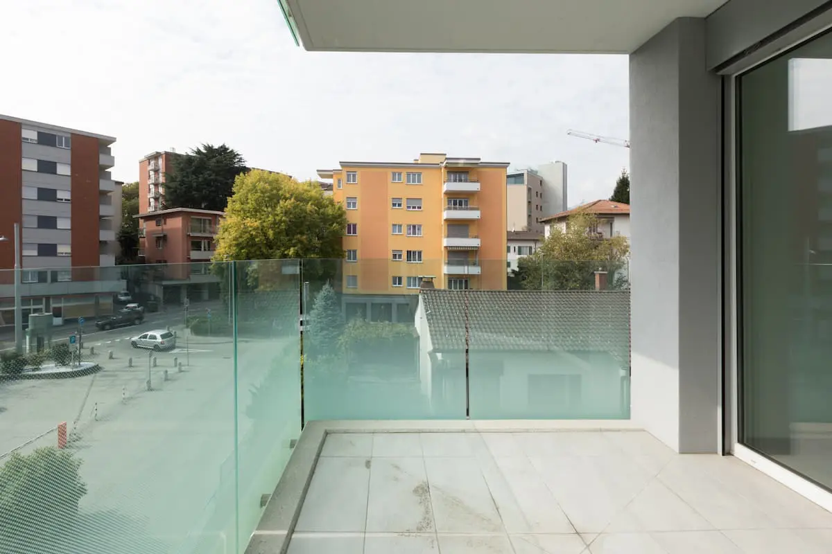 Condominium with glass porch and balcony enclosure systems