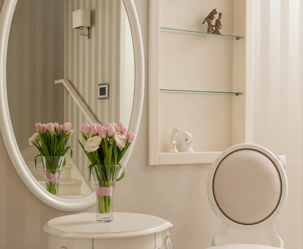 Custom corner glass shelves in a powder room