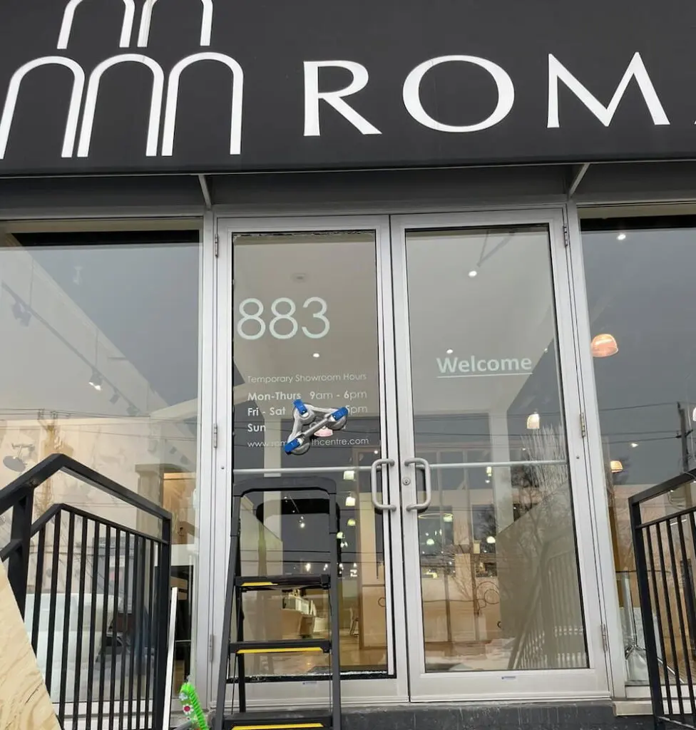 Broken storefront window requiring temporary securing and replacement