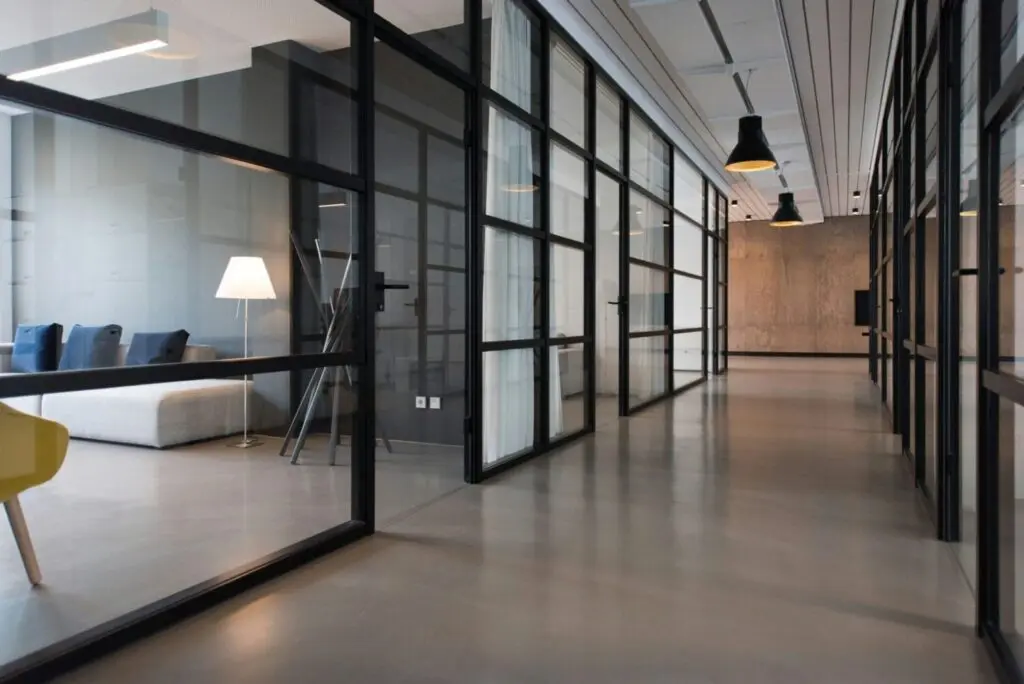 Glass office partition walls in a modern workplace
