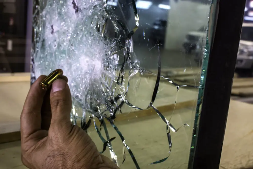 Security glazing showing impact damage retained within the panel