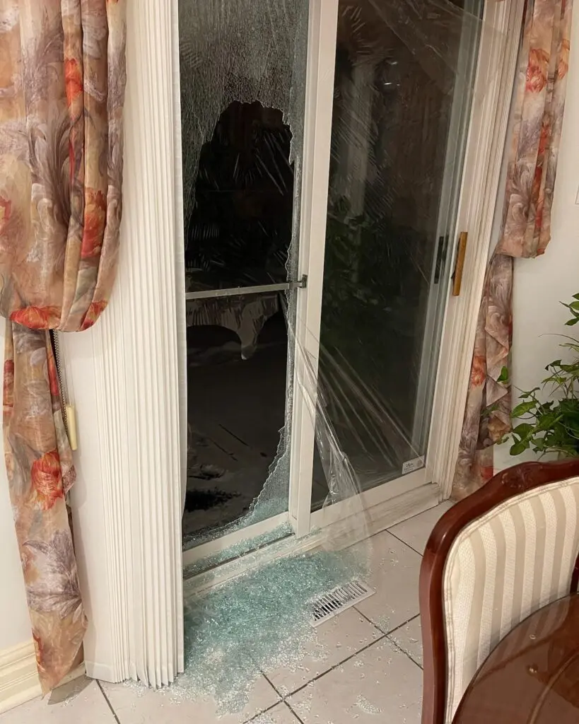 Broken sliding patio-door glass requiring replacement